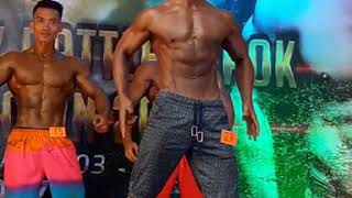 hot muscle stud flexing in bodycontest