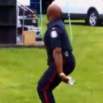 Tambourine Cop Dances At Reggae Concert