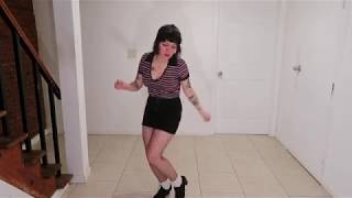 dancing to early reggae “boom shakalaka” by Hopeton Lewis