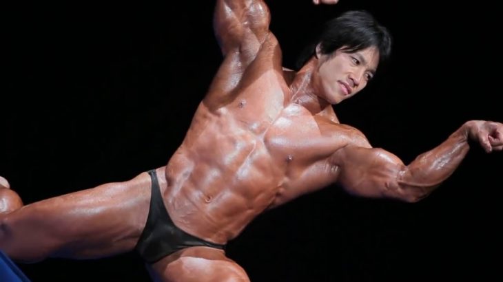 Japanese Bodybuilder posing and flexing on the stage
