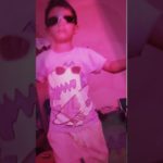 Kid flexing, showing how to dance bones